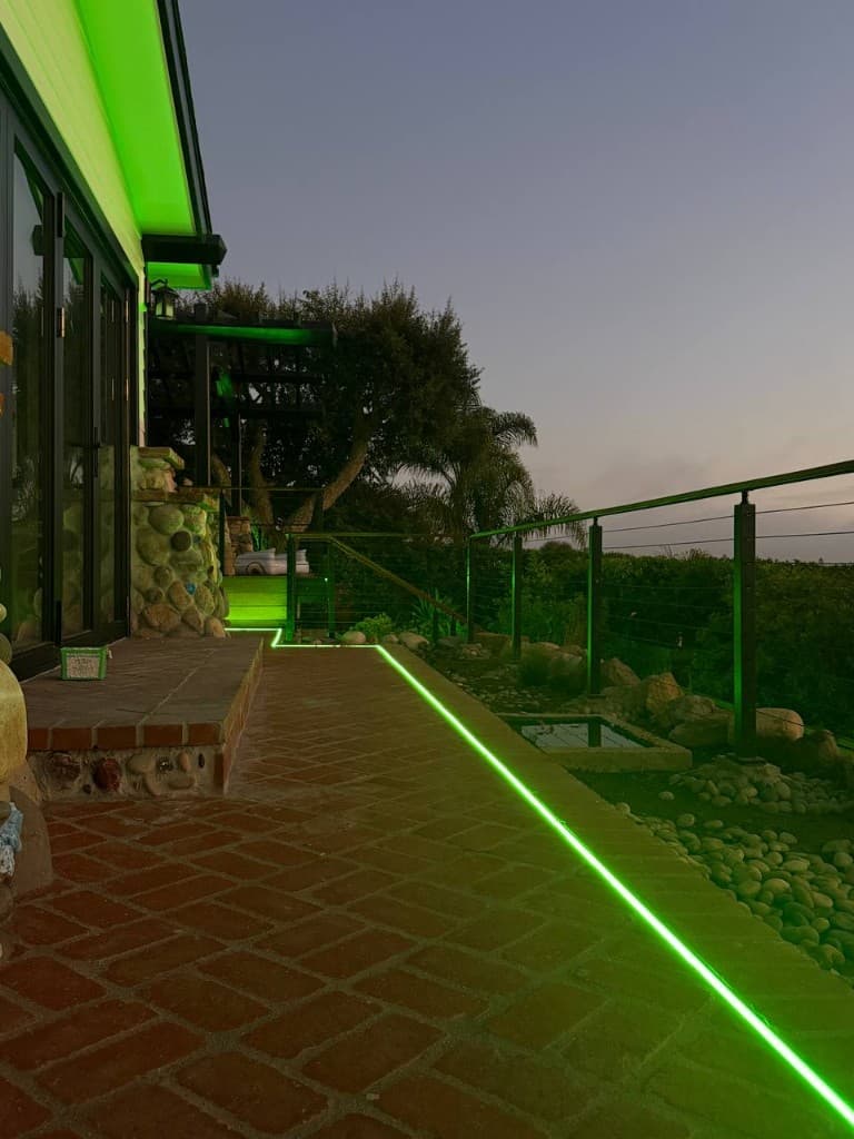 LED strip recessed along a brick patio walkway
